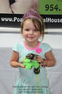 Little girl with baby marmoset monkey